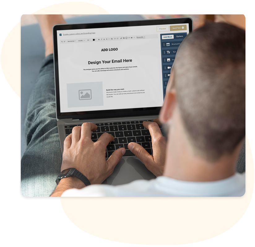 A coach designing a marketing email on a laptop